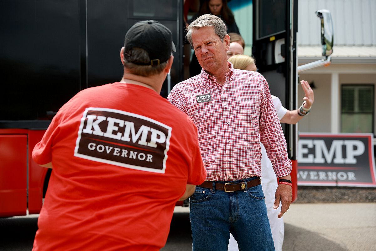 <i>Joe Raedle/Getty Images</i><br/>Republican Gov. Brian Kemp greets people as he campaigns in Watkinsville