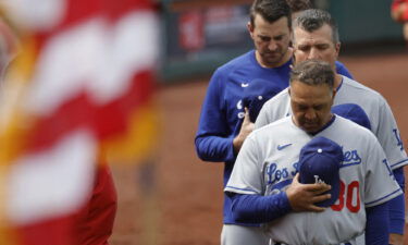 Roberts observes a moment of silence prior to the start of the Dodgers' game against the Washington Nationals.