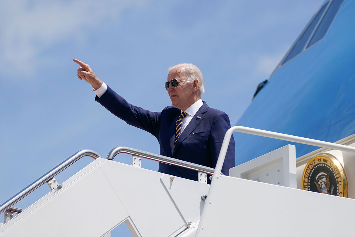 <i>Evan Vucci/AP</i><br/>President Joe Biden gestures as he boards Air Force One for a trip to South Korea and Japan on May 19