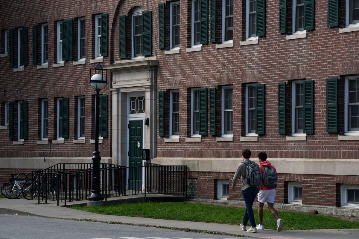 <i>Bing Guan/Bloomberg/Getty Images</i><br/>Students walk past a dormitory building on the campus of Dartmouth College in Hanover