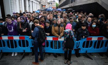 Crowds lined up outside Paddington Station to ride the first trains on London's new Elizabeth line.