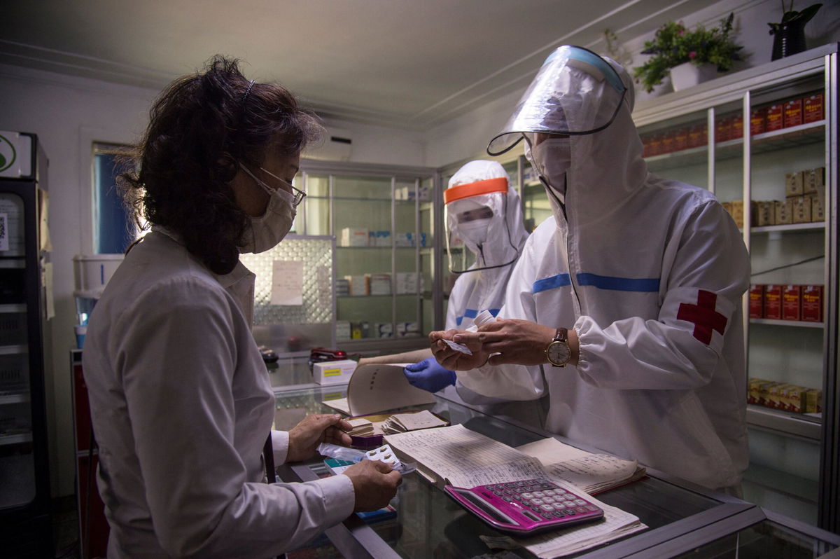 <i>Kim Won Jin/AFP/Getty Images</i><br/>North Korea says its Covid-19 outbreak is improving and it is considering revising its anti-epidemic regulations and pictured a doctor in Pyongyang on May 27.