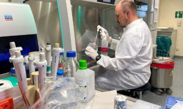 Head of the Institute of Microbiology of the German Armed Forces Roman Woelfel works in his laboratory in Munich