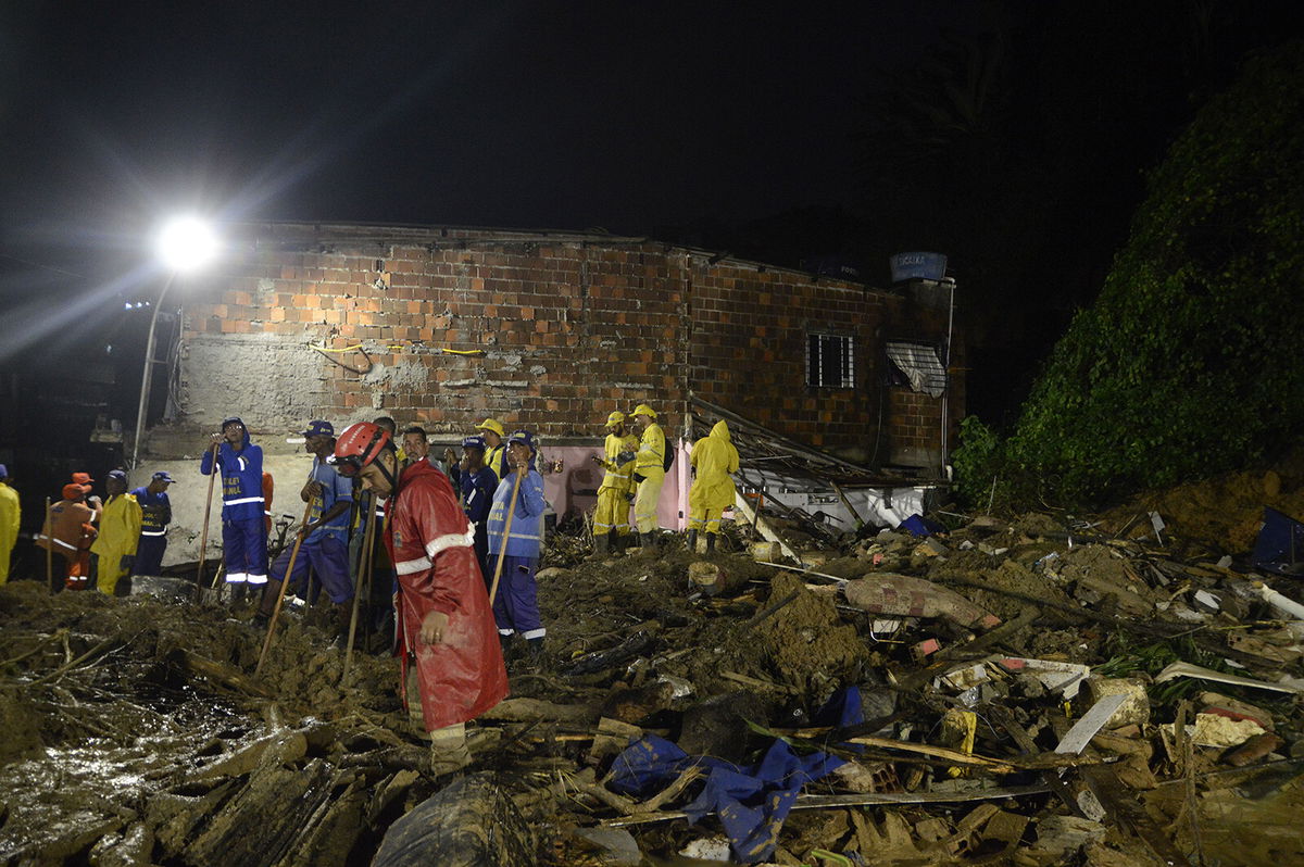 <i>Genival Paparazzi/EPA-EFE/Shutterstock</i><br/>Firefighters and volunteers pictured