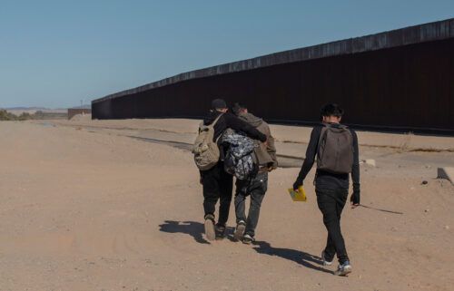 Nicaraguan migrants walk on the US-Mexico border