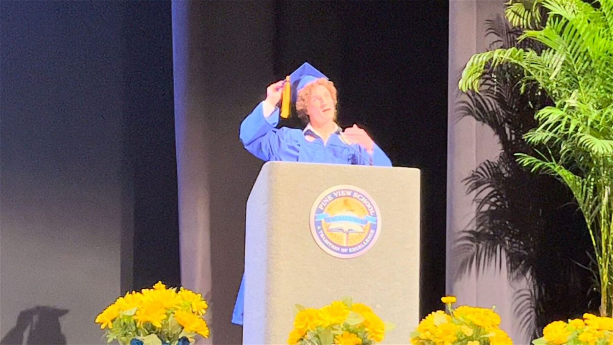 <i>courtesy Zander Moricz</i><br/>Zander Moricz takes off his hat and shows his curly hair during the graduation ceremony for Park View School to bring attention to Florida's 