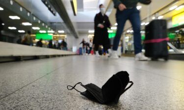 A mask is seen on the ground at John F.  Kennedy Airport on April 19 in New York City. As health officials warn of rising Covid-19 infections and hospitalizations