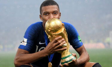 Mbappé celebrates after France wins the 2018 World Cup.