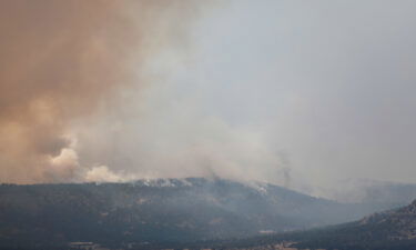 Smoke rises from the Hermits Peak and Calf Canyon wildfires.