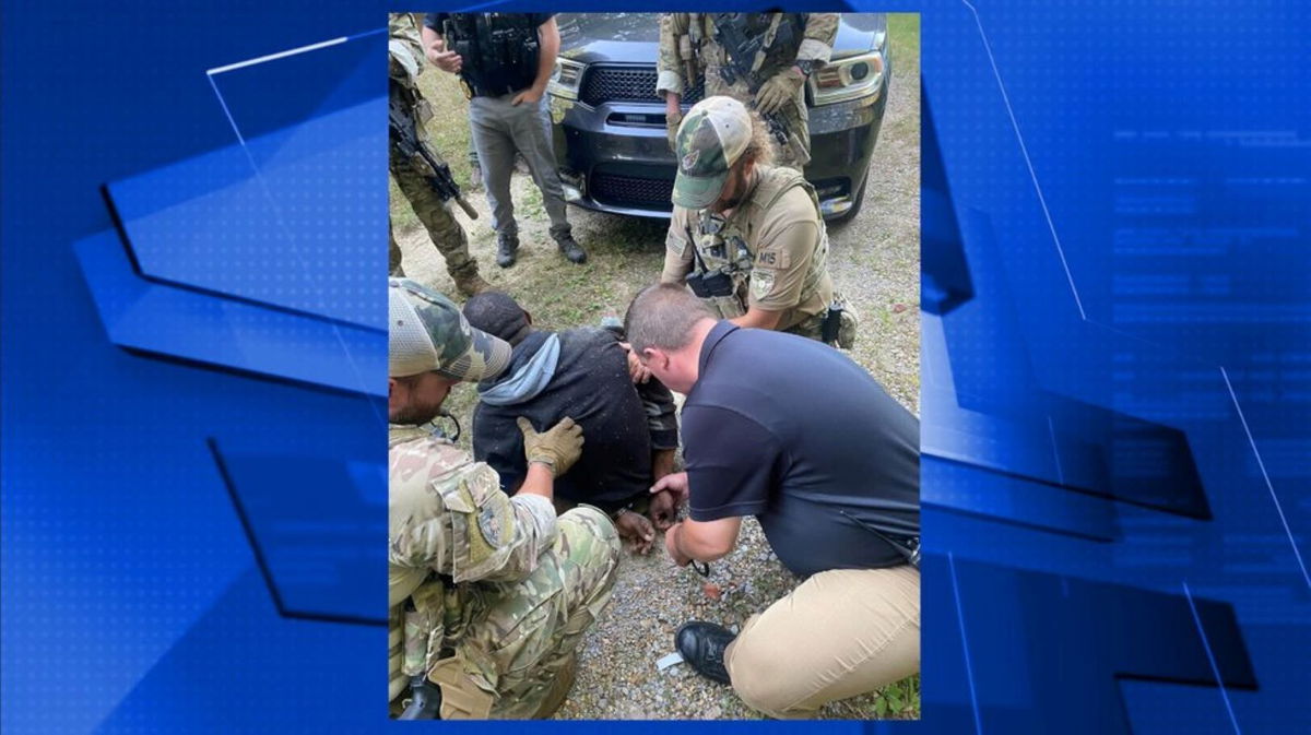 <i>Erin Police Department</i><br/>Erin Police Chief Mark Moore places handcuffs on BJ Brown.