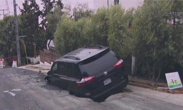 Crews with the East Bay Municipal Utility District responded to a neighborhood in the Berkeley Hills Wednesday night after a sinkhole formed and swallowed up a parked minivan.