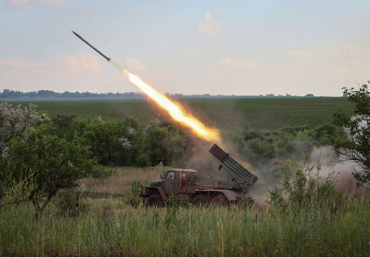 <i>Gleb Garanich/Reuters</i><br/>Ukrainian service members fire a BM-21 Grad multiple rocket launch system