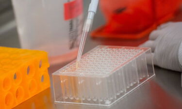 Dr. Rhonda Flores looks at protein samples at Novavax labs in Gaithersburg