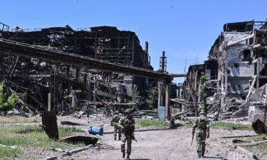 Russian servicemen patrol near the Azovstal steel plant in Mariupol