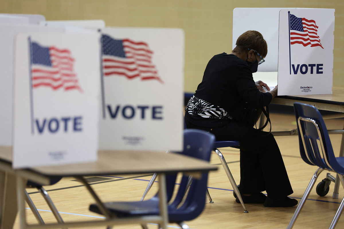 <i>Alex Wong/Getty Images</i><br/>A voter casts her ballot at a polling station at Rose Hill Elementary School during the midterm primary election on June 21 in Alexandria