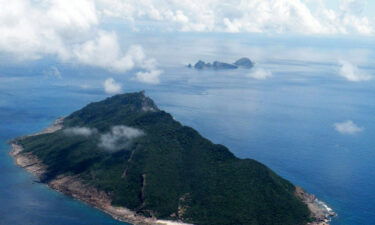 Two Chinese coast guard ships navigated Japan's territorial waters near a chain of disputed islands for more than 64 hours