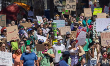 Protesters march to denounce the US Supreme Court decision to end federal abortion rights protections on Sunday