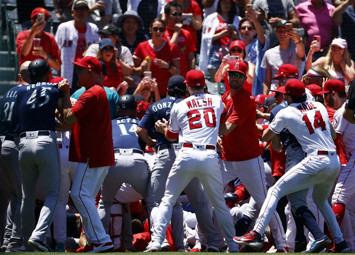 <i>Ronald Martinez/Getty Images North America/Getty Images</i><br/>The Seattle Mariners and the Los Angeles Angels clear the benches after Seattle's Jesse Winker charged the Angels dugout after being hit by a pitch in the second inning.
