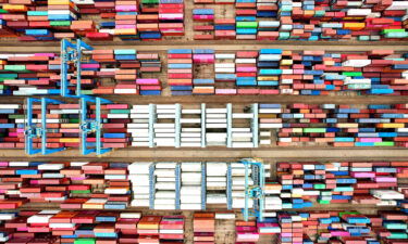 Pictured are cargo containers stacked at a port in Qingdao