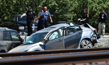 Contra Costa Sheriff deputies investigate the scene after an Amtrak train collided with a vehicle in Brentwood