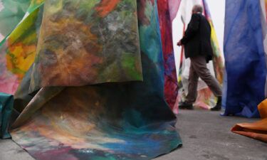 A man walks past Gilliam's work "untitled" during the preview day of Art Basel in 2018.