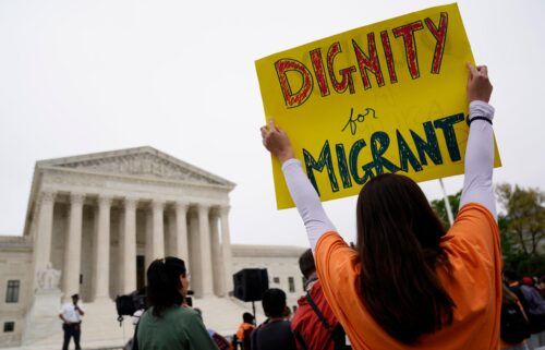 Immigration activists rally outside the US Supreme Court in Washington