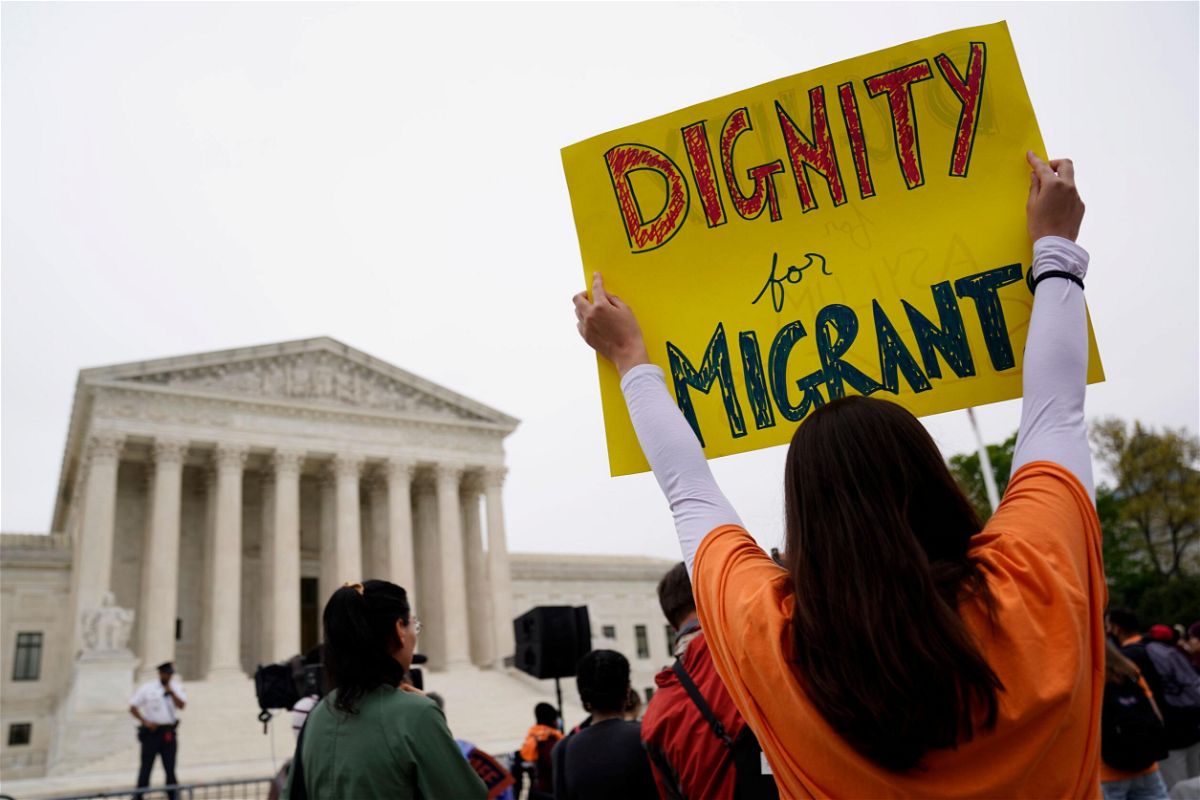 <i>Will Oliver/EPA-EFE/Shutterstock</i><br/>Immigration activists rally outside the US Supreme Court in Washington