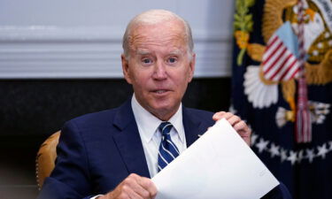 President Joe Biden stops by a meeting in the Roosevelt Room of the White House in Washington