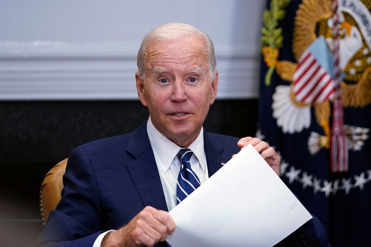 <i>Susan Walsh/AP</i><br/>President Joe Biden stops by a meeting in the Roosevelt Room of the White House in Washington