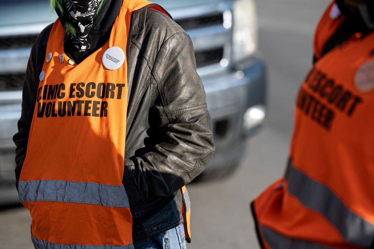 <i>Jon Cherry/Getty Images</i><br/>Kentucky state court blocks two state laws that stopped abortion services after Roe ruling. Clinic escorts are seen standing in front of the EMW Women's Surgical Center