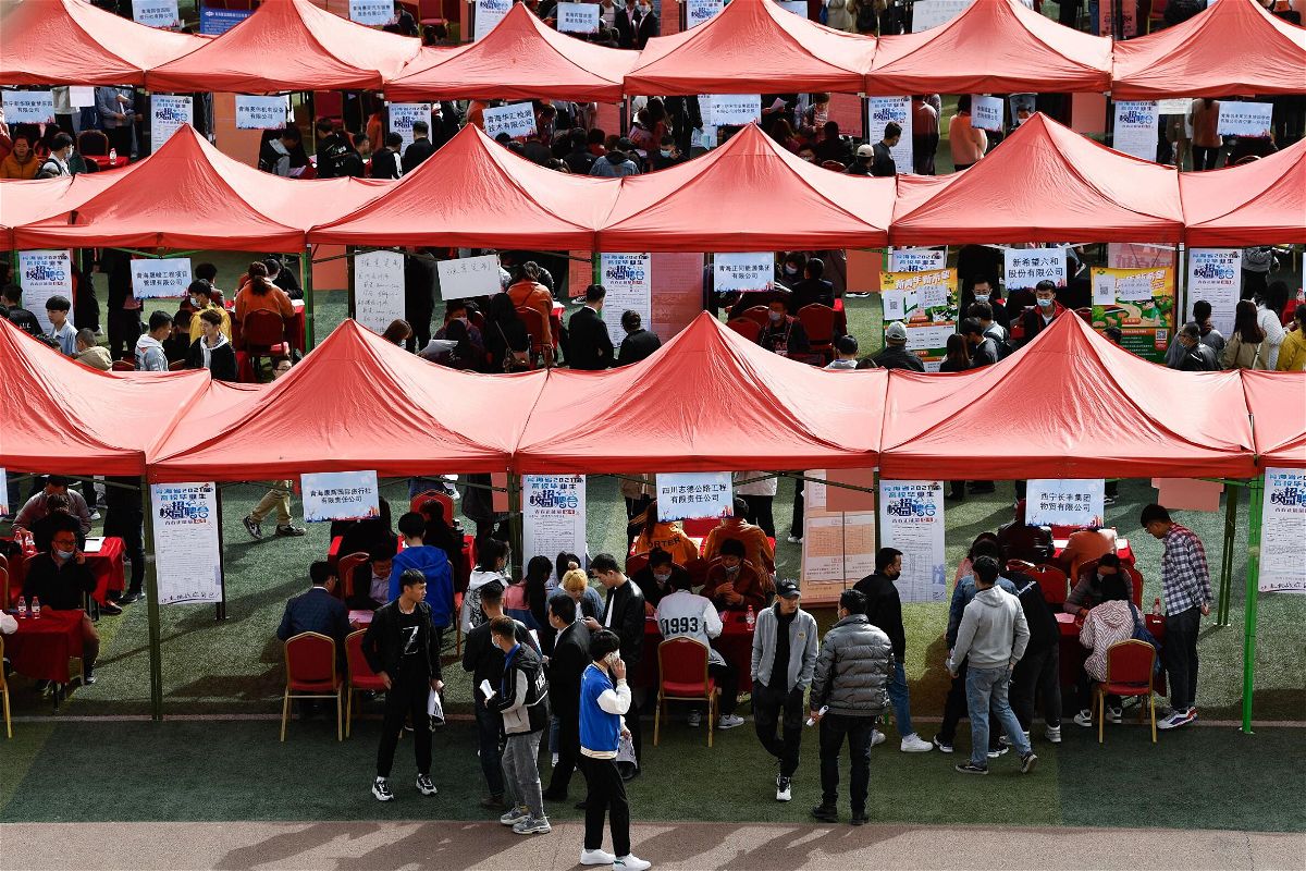 <i>Zhang Long/Xinhua/Getty Images</i><br/>Students look for job during a campus job fair in Xining