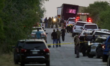 Police and other first responders work the scene where officials say dozens of people were found dead in San Antonio.