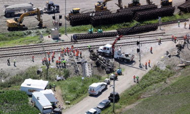 Members of the National Transportation Safety Board arrive to investigate Monday's Amtrak Derailment after the train struck a dump truck at an uncontrolled crossing in Mendon