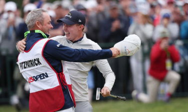 Fitzpatrick celebrates with caddie Billy Foster after winning the US Open.