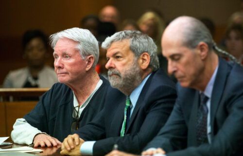 From left: Claud "Tex" McIver sits with his attorneys Don Samuel and Bruce Harvey after being sentenced to life in prison with the possibility of parole at the Fulton County courthouse in Atlanta on May 23
