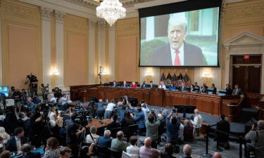 A video of former President Donald Trump is shown on a screen