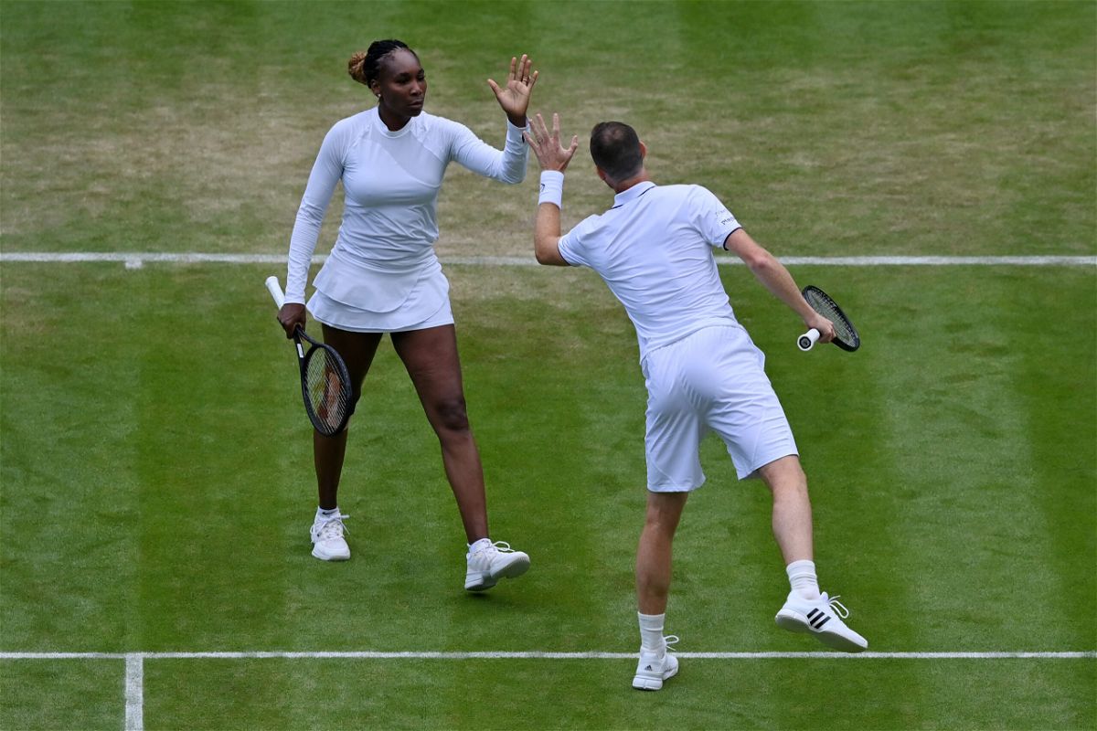 <i>Justin Setterfield/Getty Images Europe/Getty Images</i><br/>The pair proved popular with the Wimbledon crowd.