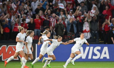 England celebrates after Lucy Bronze scores the second goal.