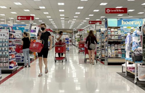 Most major grocery stores and retailers are open and pictured customers shop at a Target store on June 8