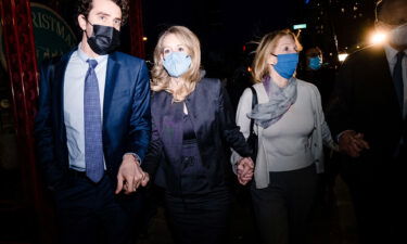 Elizabeth Holmes walks outside of federal court after she was found guilty on 4 of 11 accounts faced in her fraud trial in San Jose