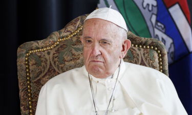 Pope Francis listens to indigenous drummers as he is welcomed to Canada