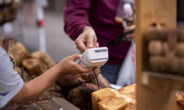 A customer purchases at a farmers market in Chicago