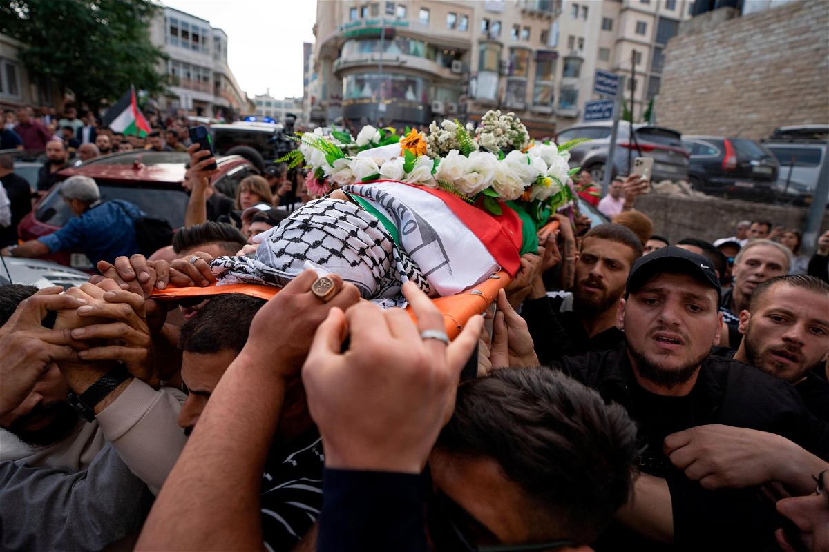 <i>Nasser Nasser/AP</i><br/>US says Israeli military gunfire is likely responsible for Shireen Abu Akleh's death but examination of the bullet is inconclusive. Palestinian mourners carry the body of Abu Akleh in the West Bank city of Ramallah