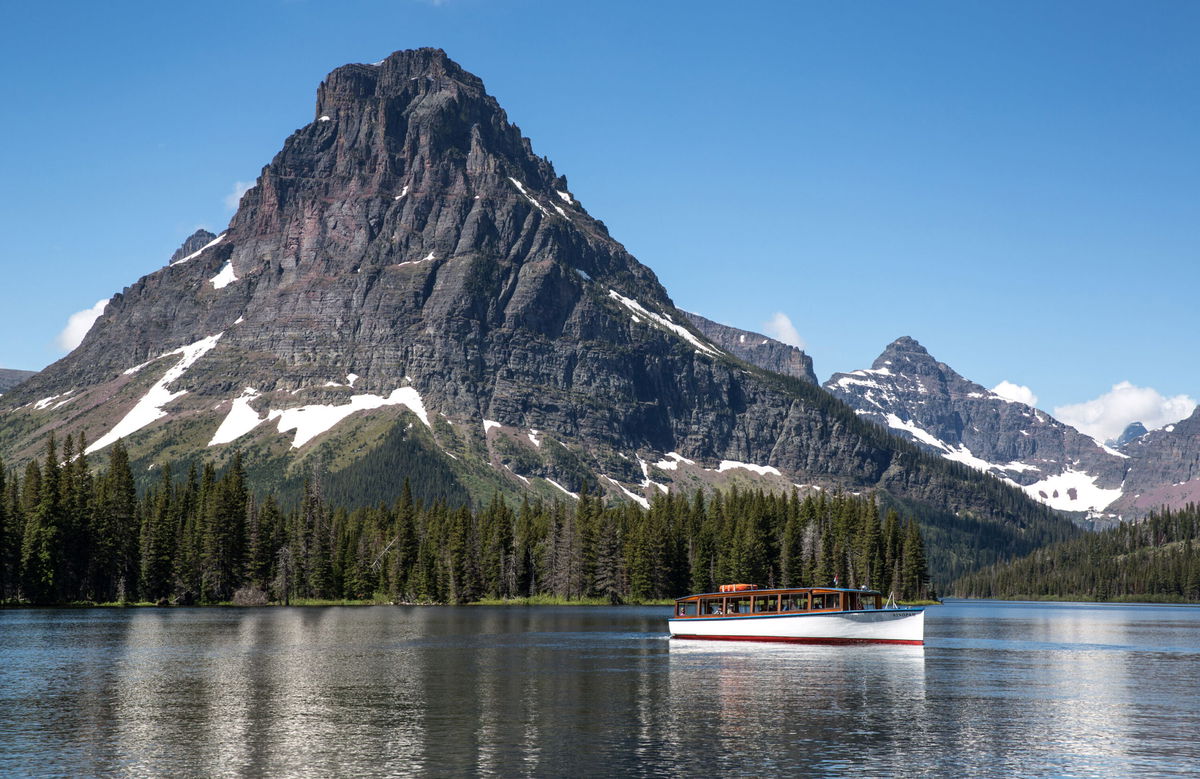 <i>George Rose/Getty Images</i><br/>Rising Wolf Mountain at Two Medicino Lake on June 20