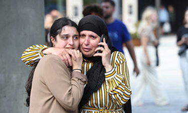 People react outside Field's shopping center in Copenhagen