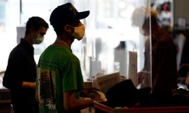 Employees check out customers at the 2nd Street second hand store