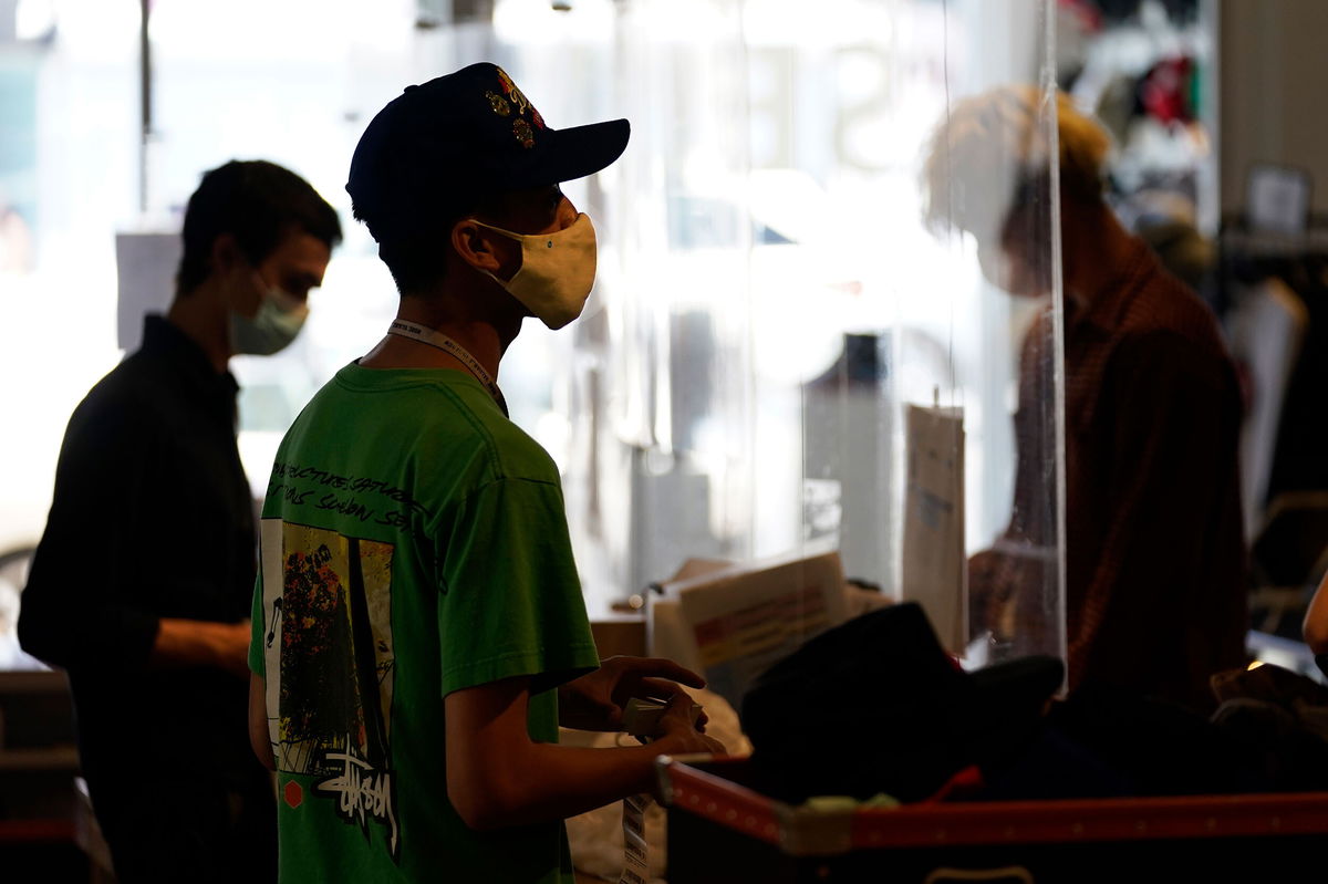 <i>Marcio Jose Sanchez/AP</i><br/>Employees check out customers at the 2nd Street second hand store