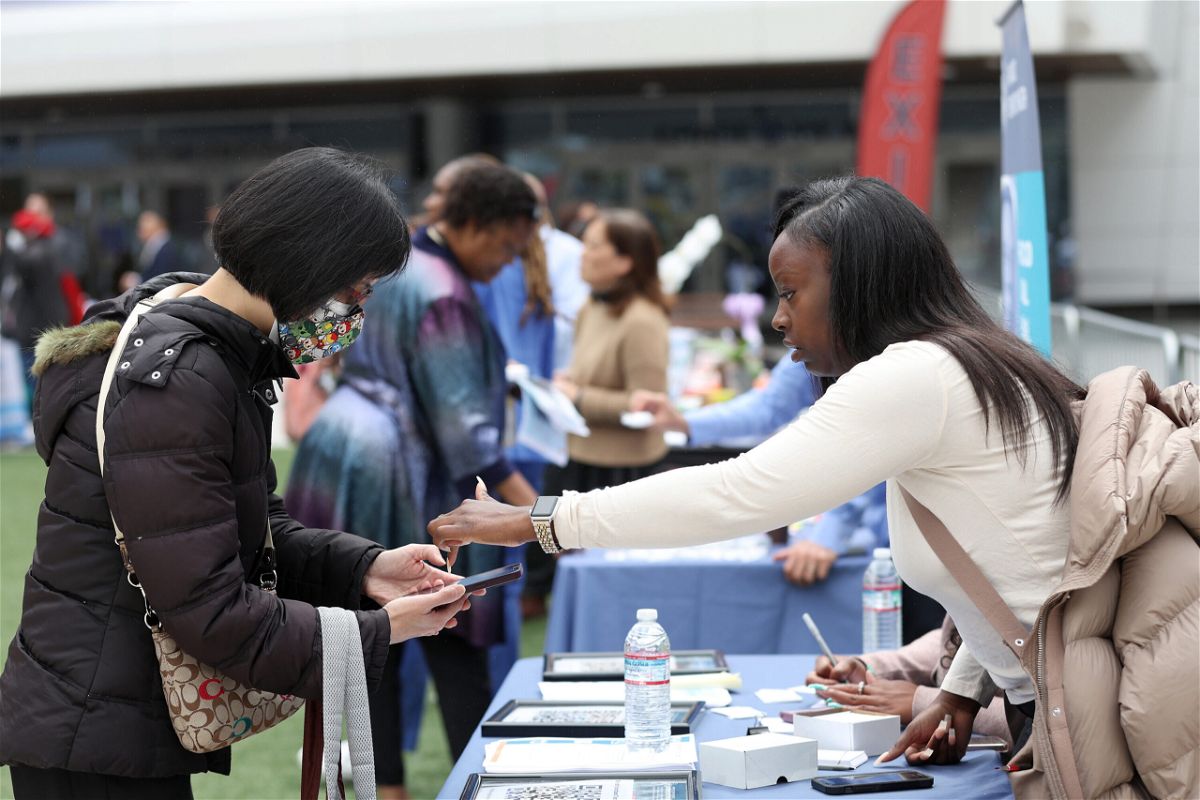 <i>Justin Sullivan/Getty Images</i><br/>A job seeker meets with a recruiter during the Healthcare Academy career and training fair outside of the Chase Center on June 03