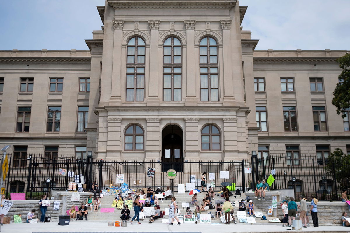 <i>Ben Gray/AP</i><br/>A small group gathers at the steps of the Georgia State Capitol protesting the overturning of Roe v. Wade on Sunday