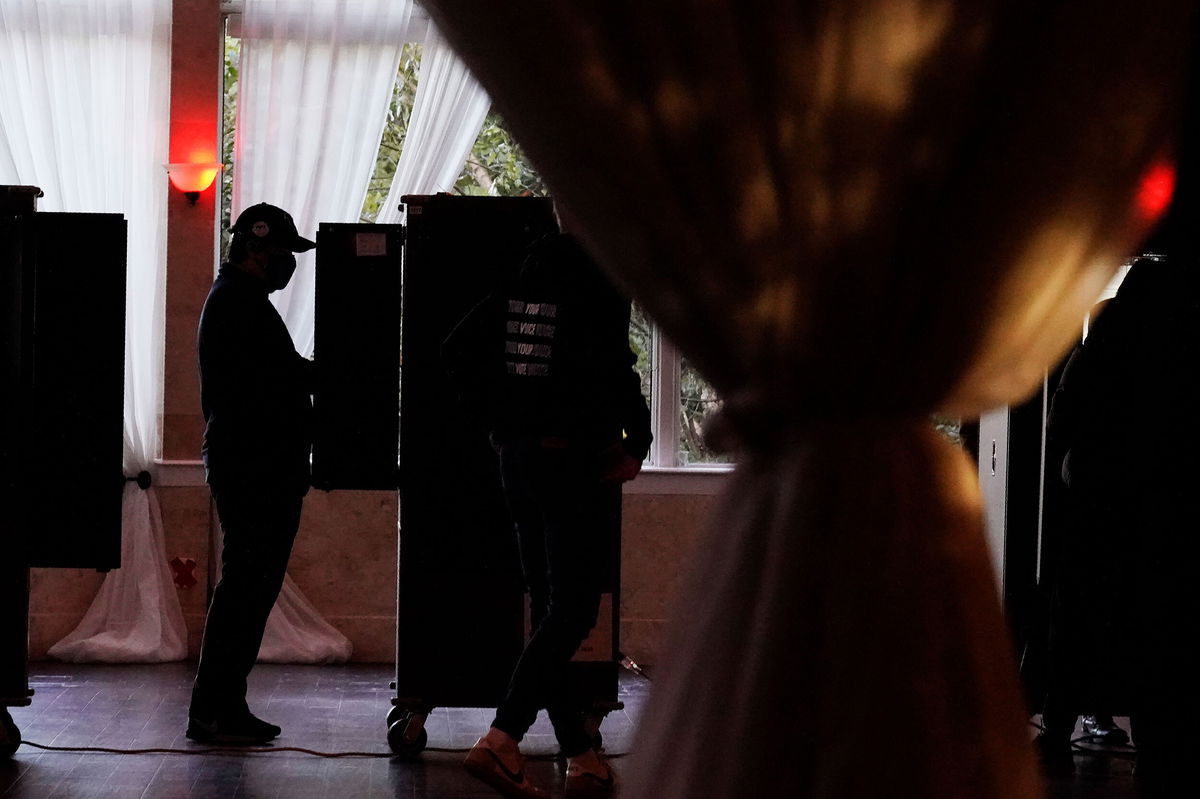 <i>Brynn Anderson/AP</i><br/>A voter casts their ballot on Election Day in Atlanta on November 3